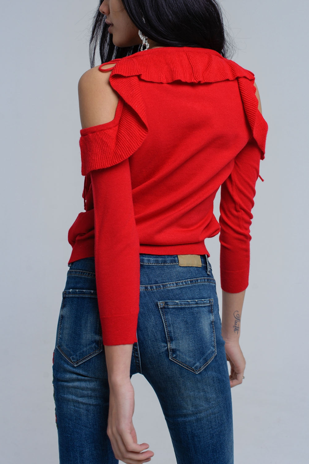 Red sweater with ruffle detail at front