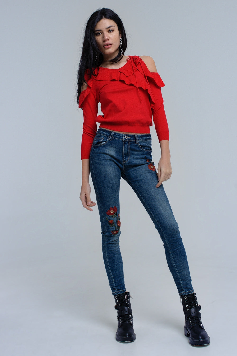 Red sweater with ruffle detail at front