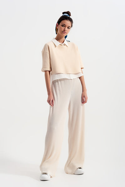 Relaxed wide leg trousers in plisse cream