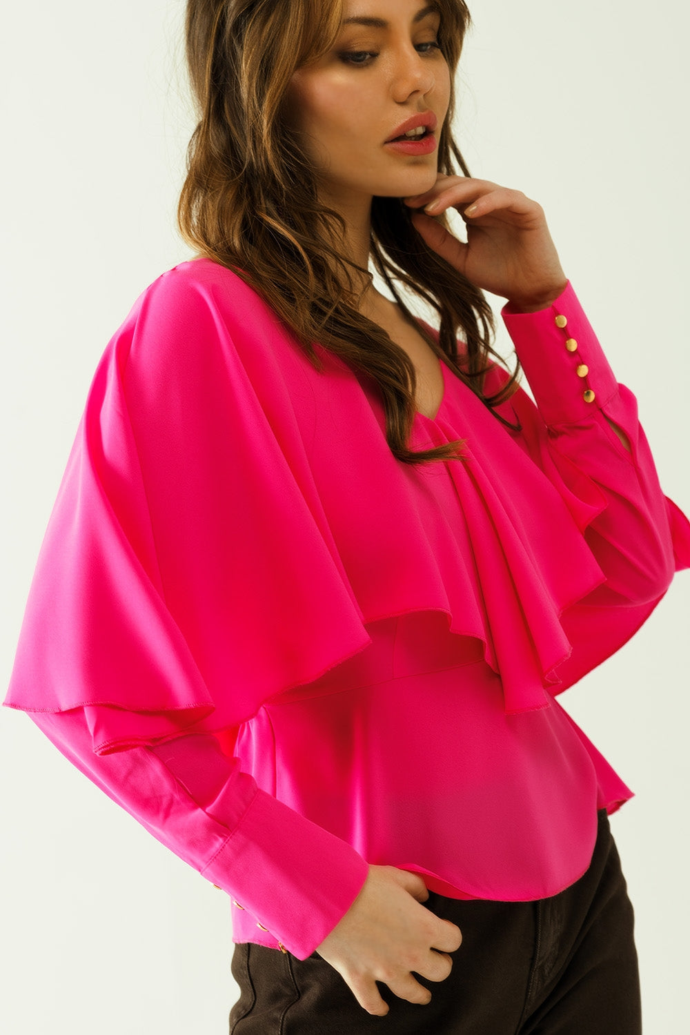 Ruffled V-neck top with buttoned cuffs and tie in the back detal in fuchsia