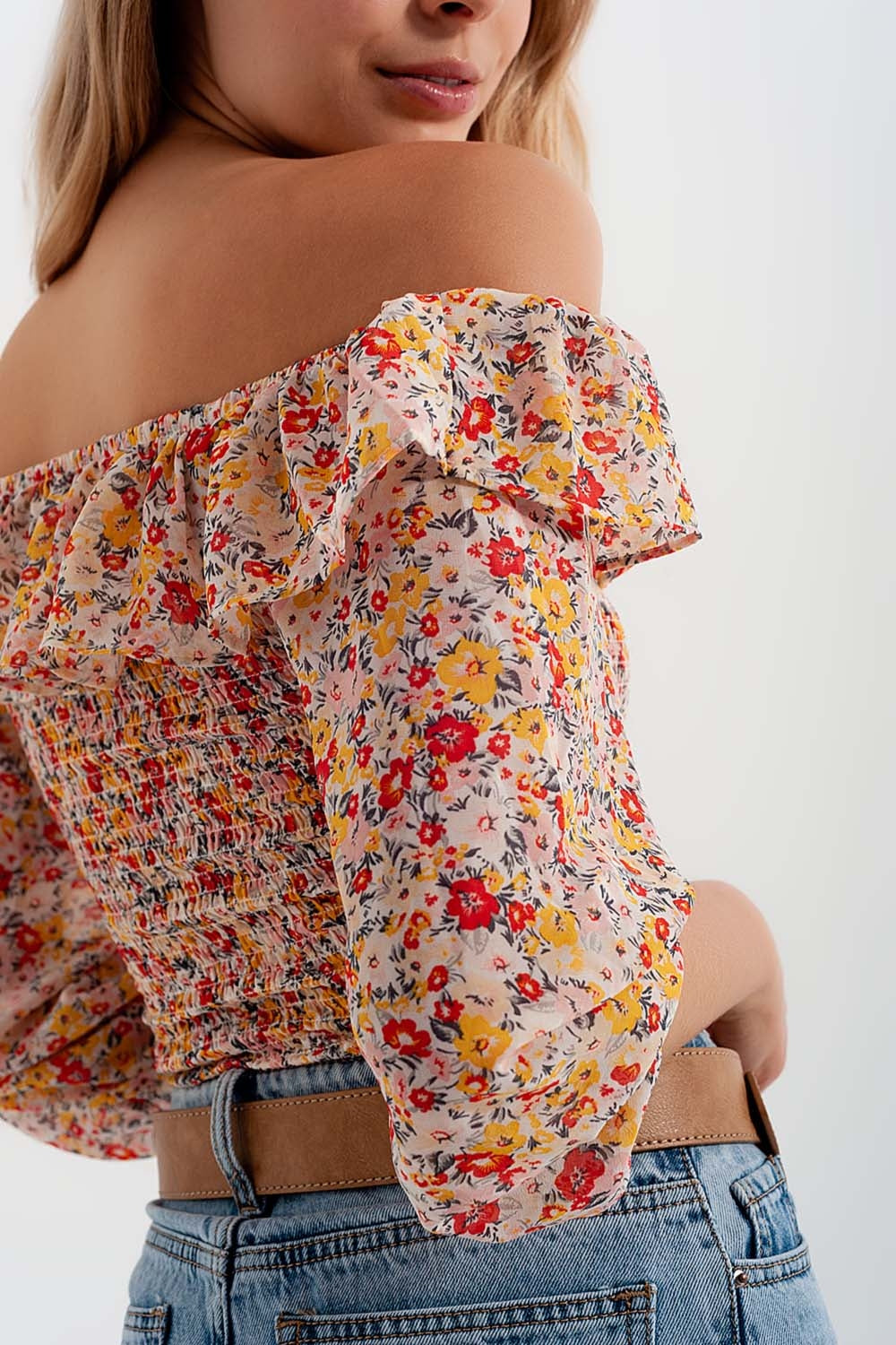 Shirred off the shoulder top with ruffle in coral floral print