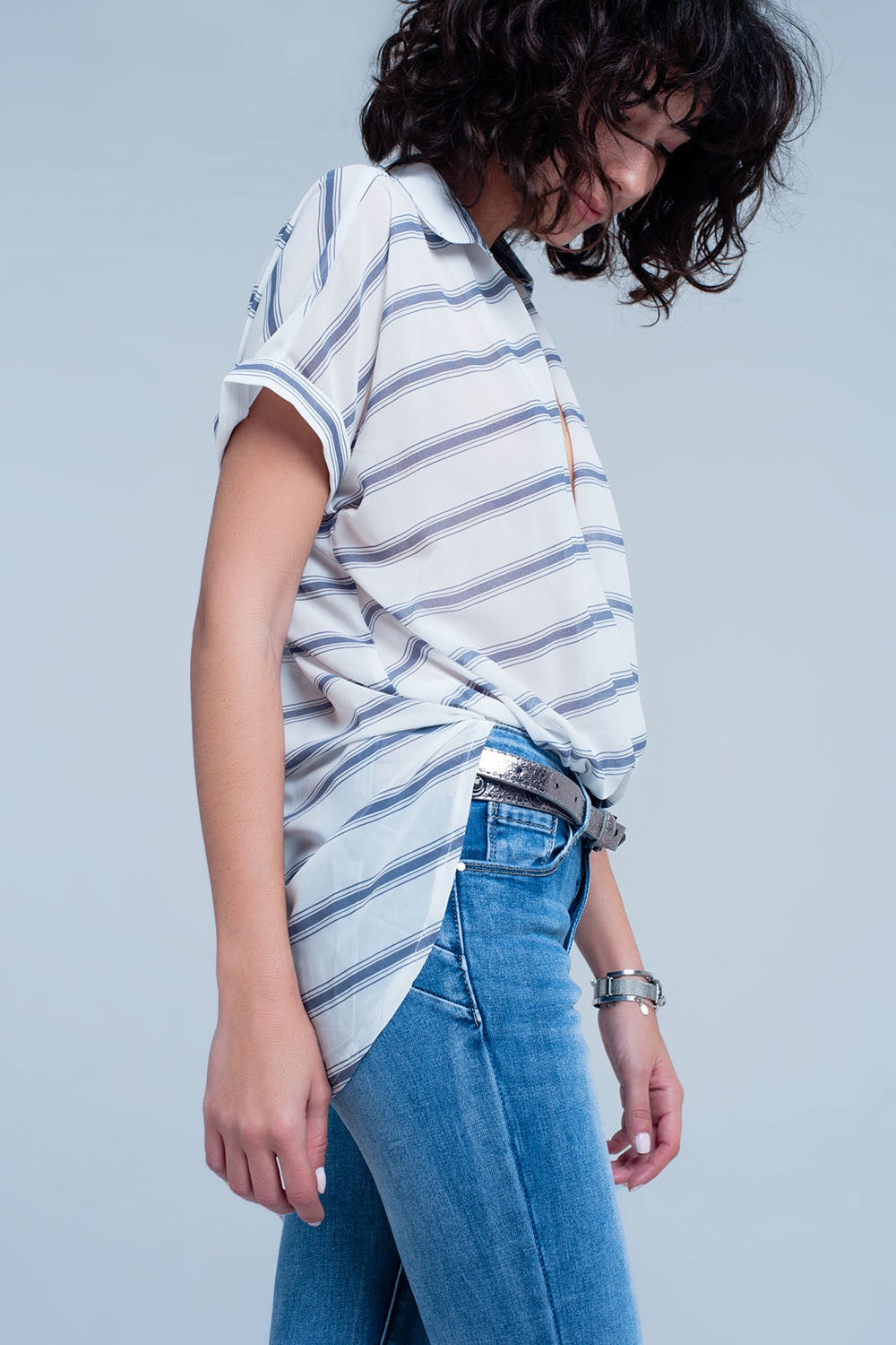 White short sleeve drape wrap blouse with blue striped design