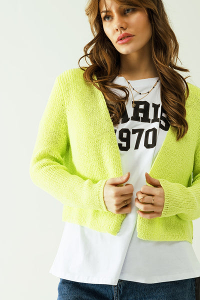 Short yellow knit cardigan with long sleeves