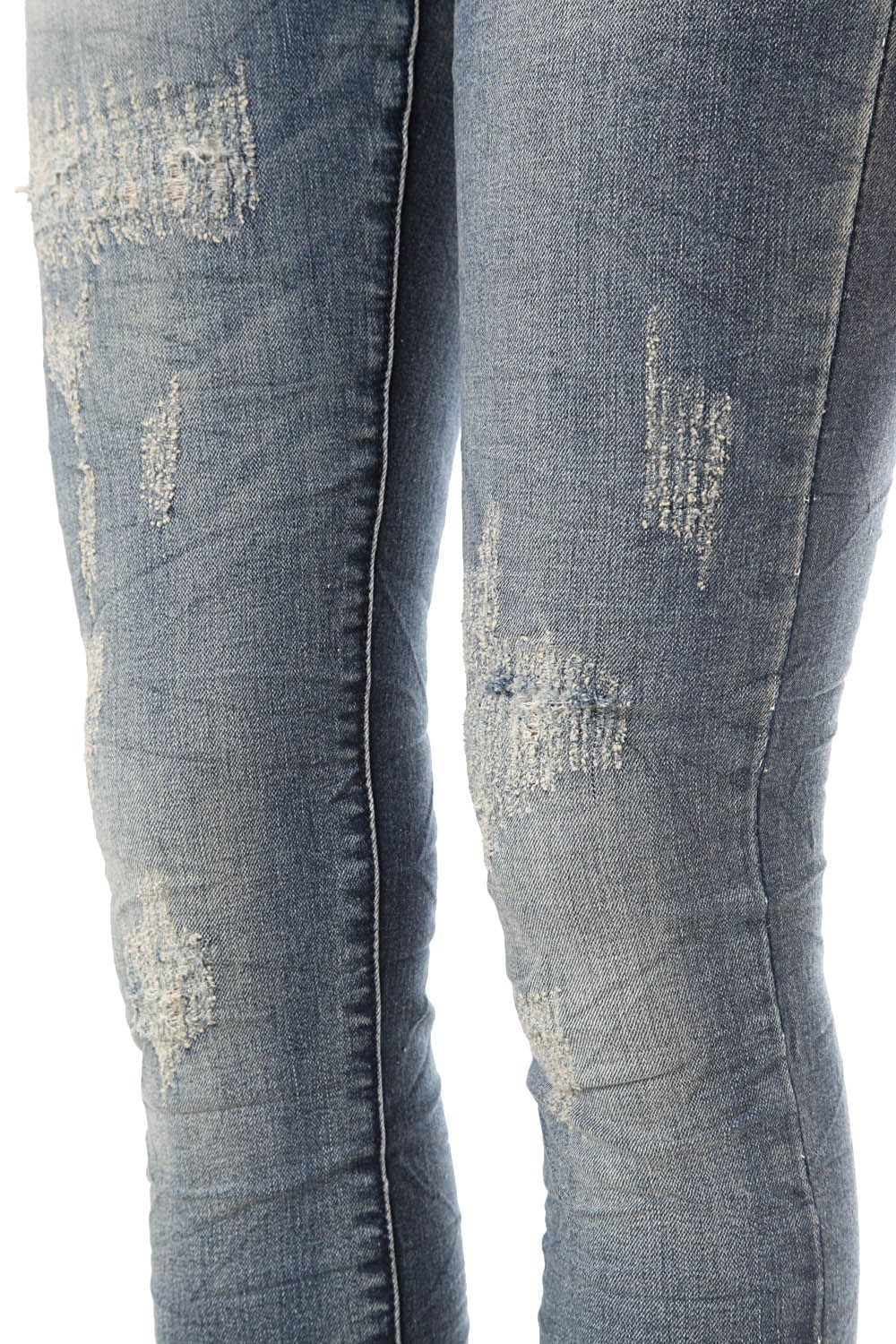 Skinny jeans in mid-blue wash with light fading