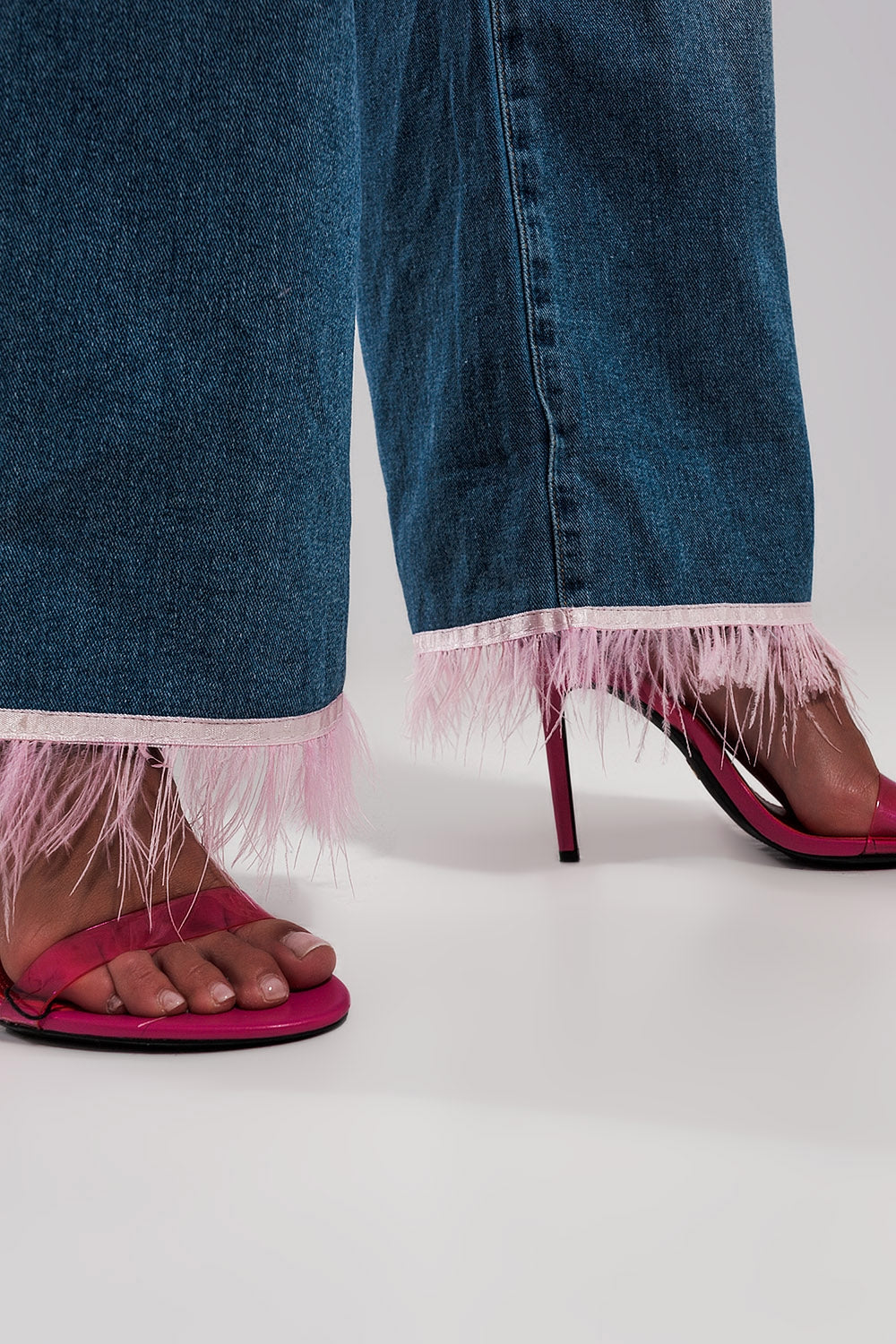 Straight leg jeans with PINK faux feather hem