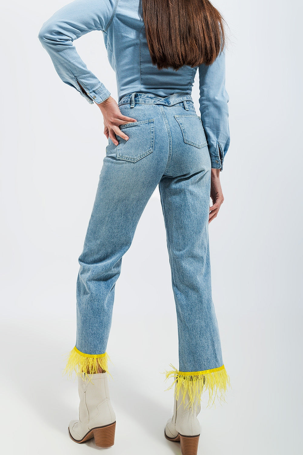 Straight leg jeans with yellow faux feather hem