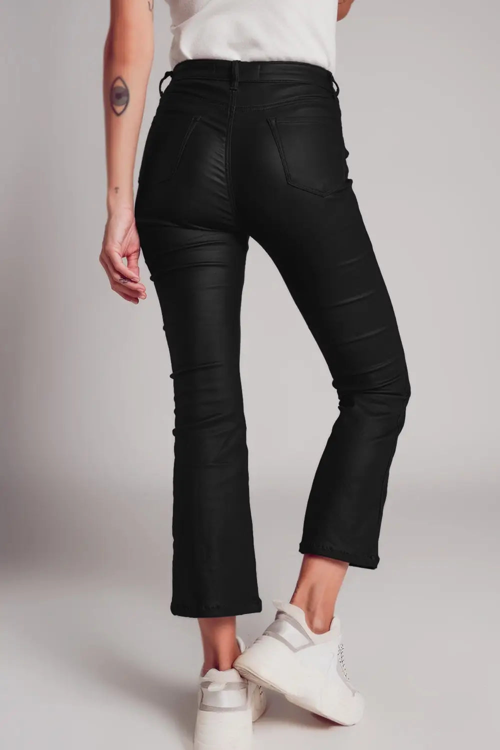 Stretch faux leather flare pants in black - Pants