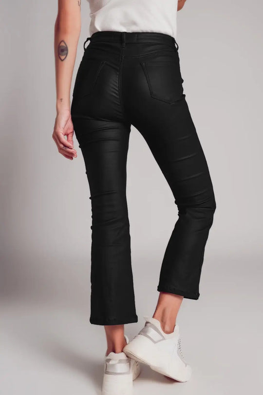 Stretch faux leather flare pants in black - Pants