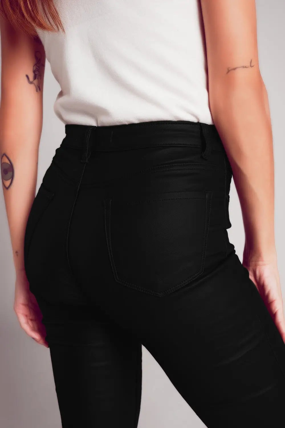 Stretch faux leather flare pants in black - Pants