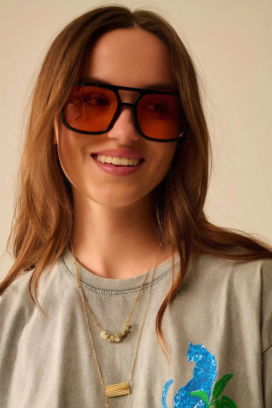 Sunglasses with black frames and orange lenses - One Size / Orange