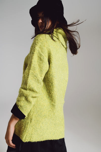 Sweater in green with a bardot neck.