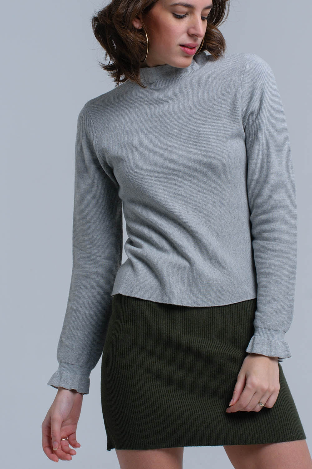 Sweater with ruffle in gray