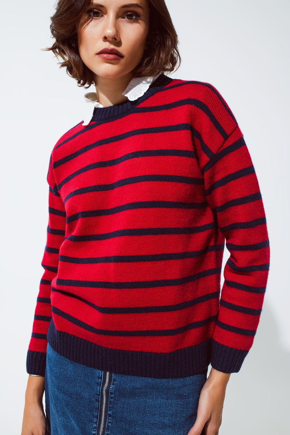 Red sweater with blue stripes and a white crew neck