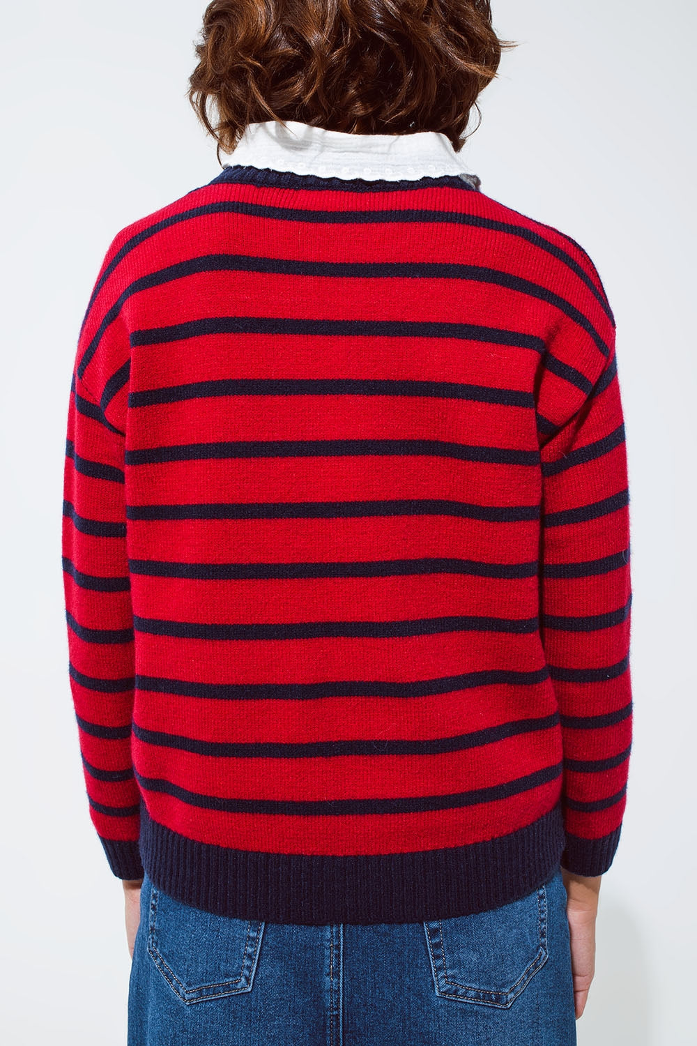 Red sweater with blue stripes and a white crew neck