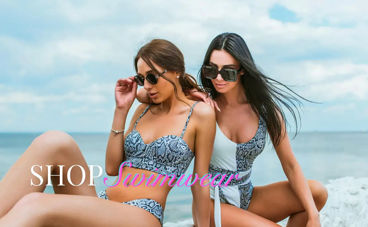 The swimsuit features a striking snakeskin pattern in shades of gray and white, with thin straps and a flattering cut.
