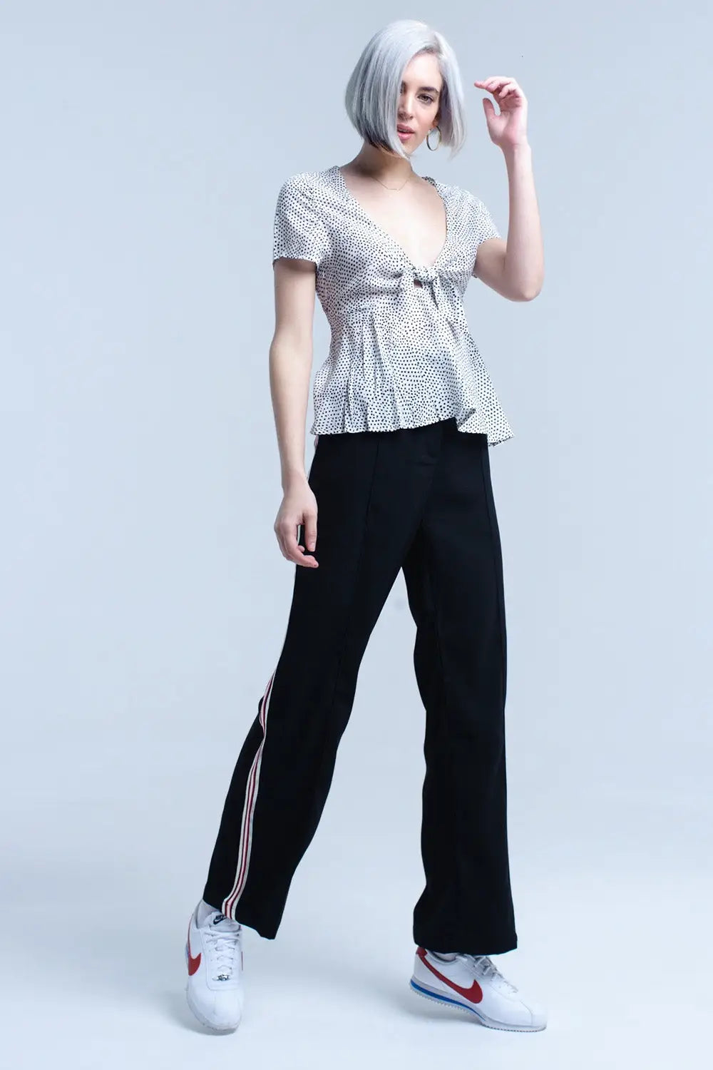 Top blanc à pois avec ourlet à volants - Tee-Shirt