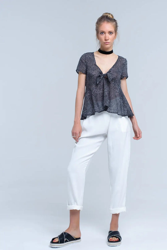 Top noir à pois avec ourlet à volants - Tee-Shirt