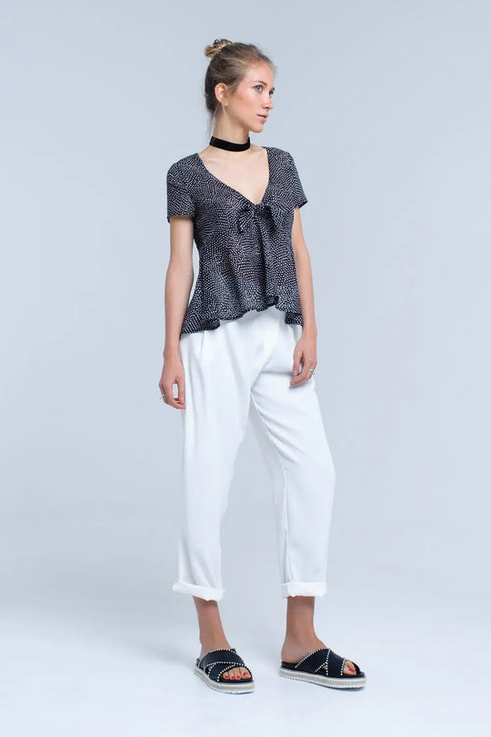 Top noir à pois avec ourlet à volants - Tee-Shirt