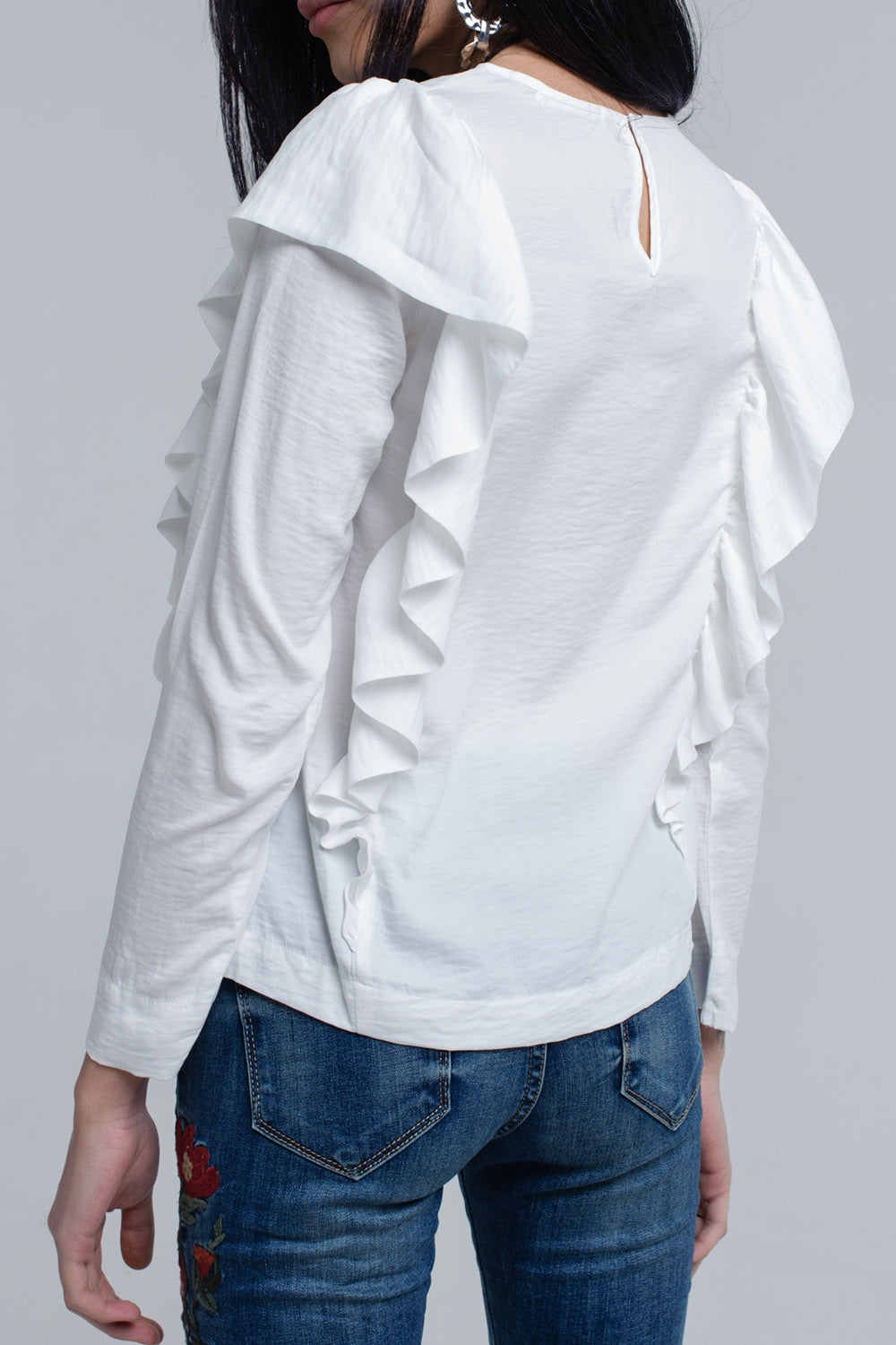 Top with ruffle detail in cream