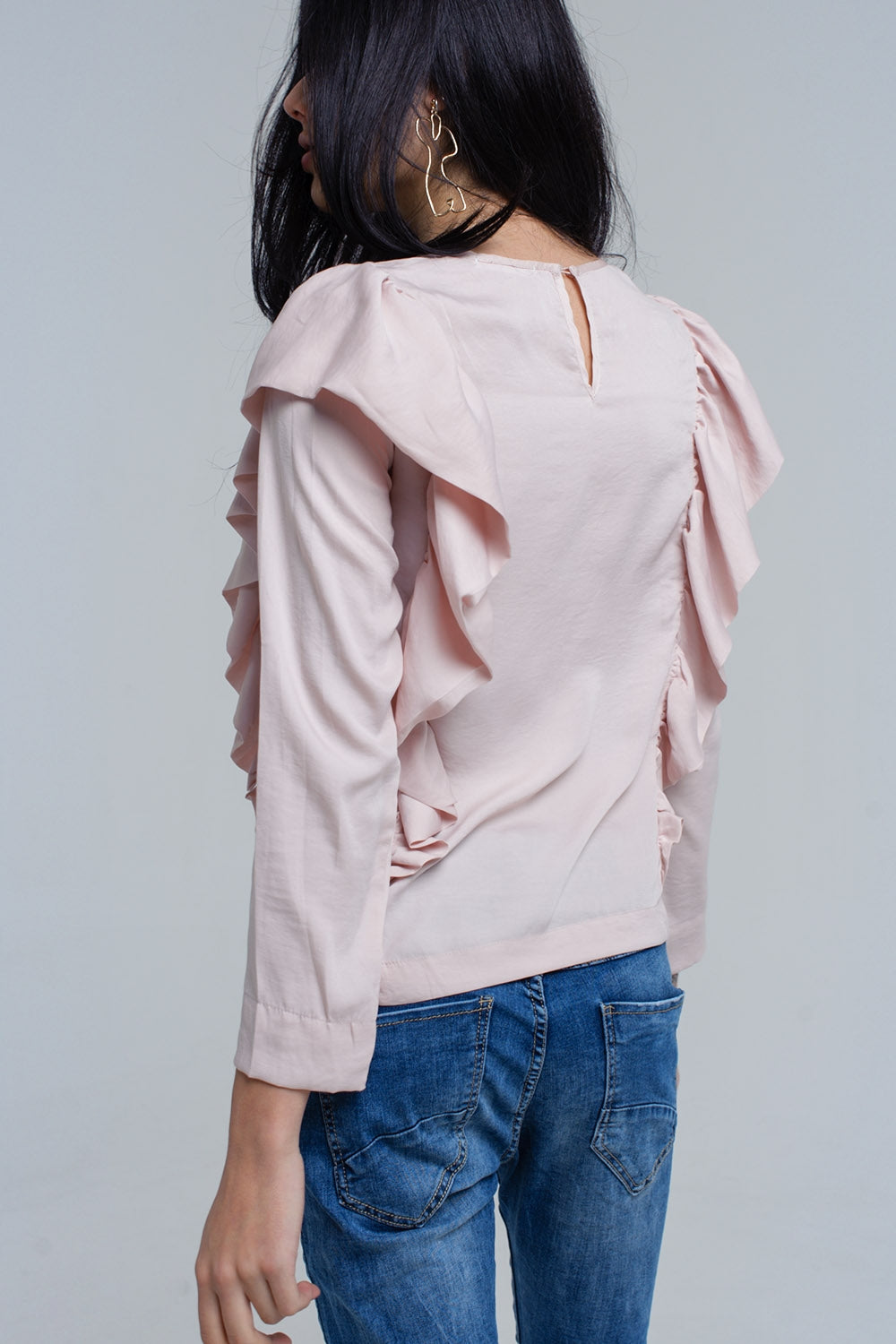 Top with ruffle detail in pale pink