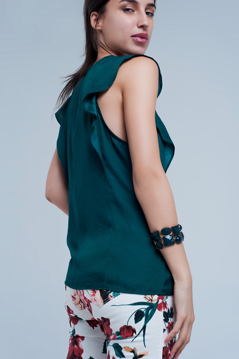 Top with ruffles in dark green