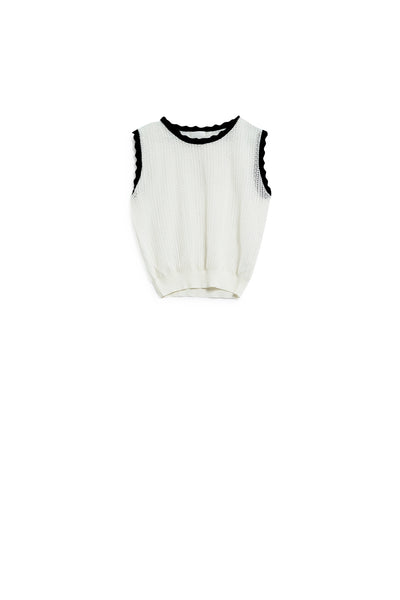 white knitted pointelle top with black wavy trim