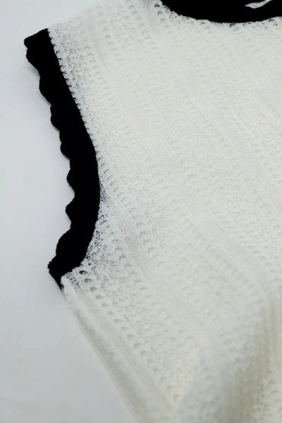white knitted pointelle top with black wavy trim - Sweaters