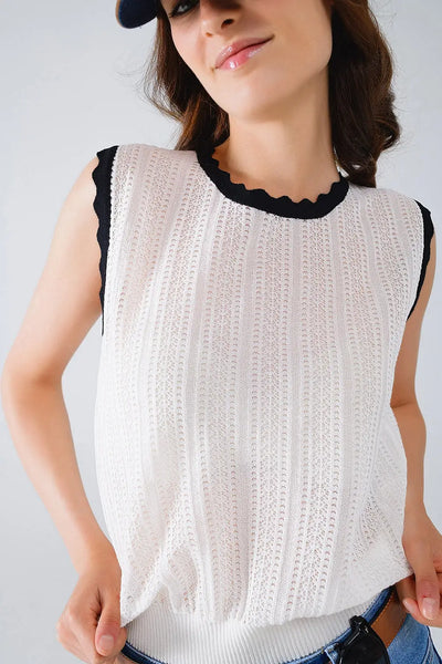 white knitted pointelle top with black wavy trim - Sweaters