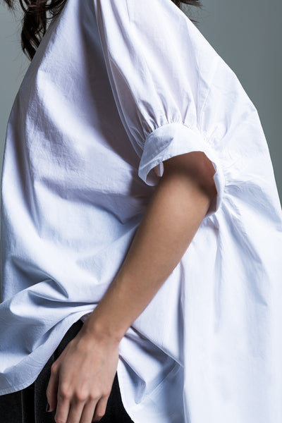 White oversized blouse with short sleeves