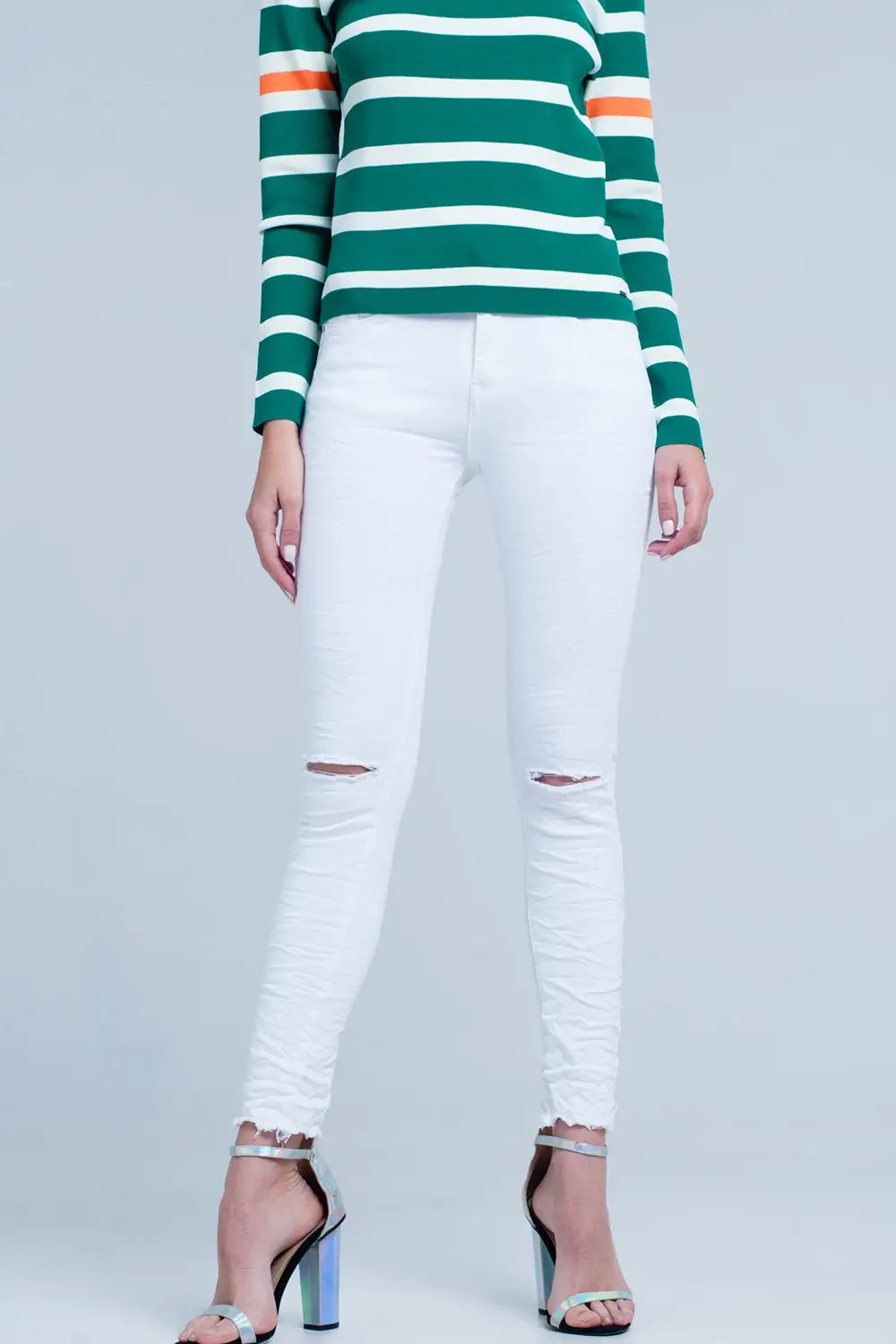 Q2 White skinny jeans with ripped knees detail