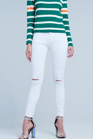 Q2 White skinny jeans with ripped knees detail