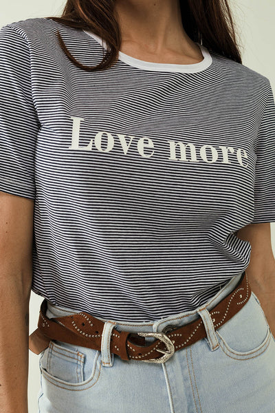 White T-shirt with black stripes and Love More texted