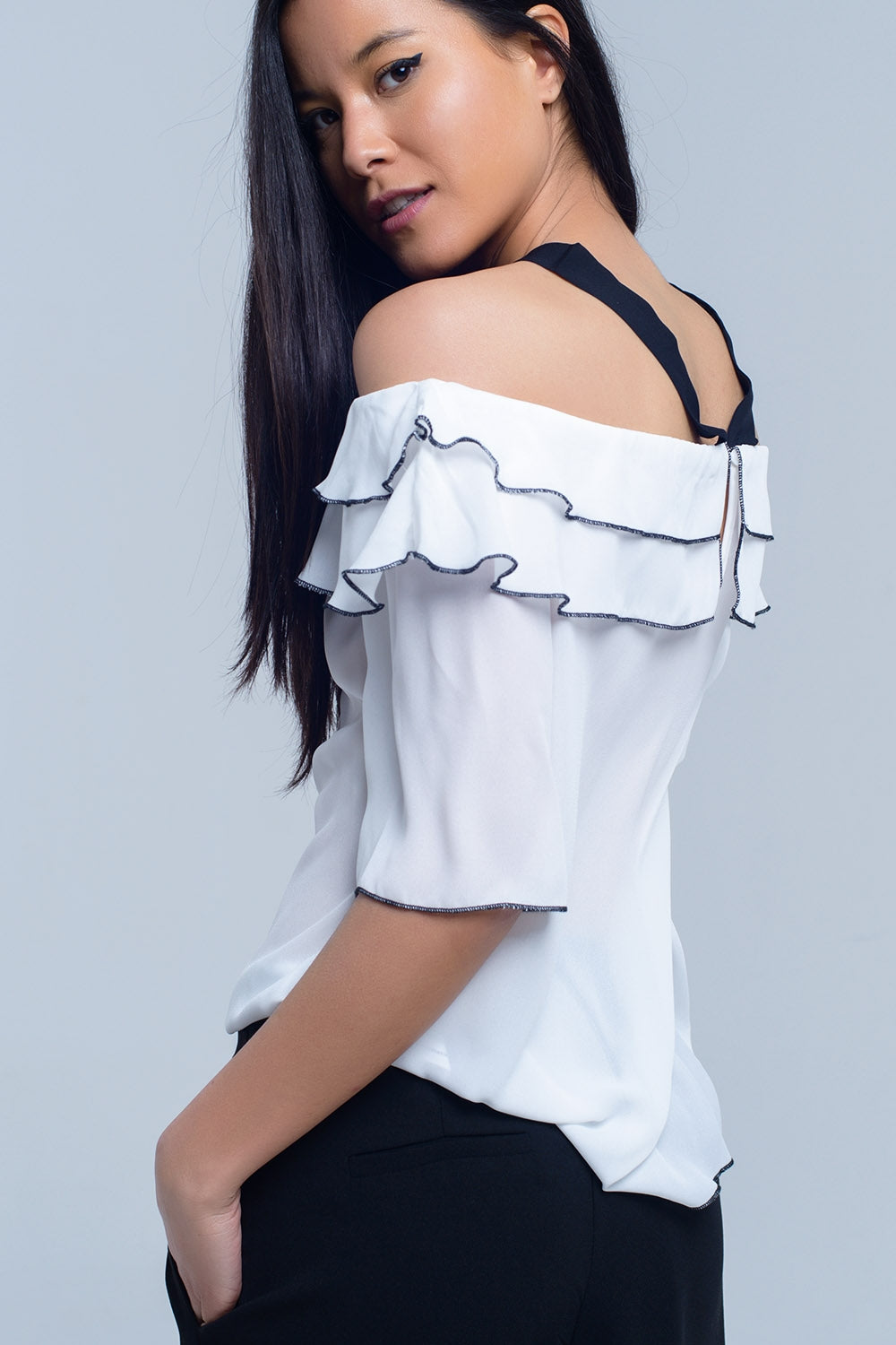 White top with black contrast trim