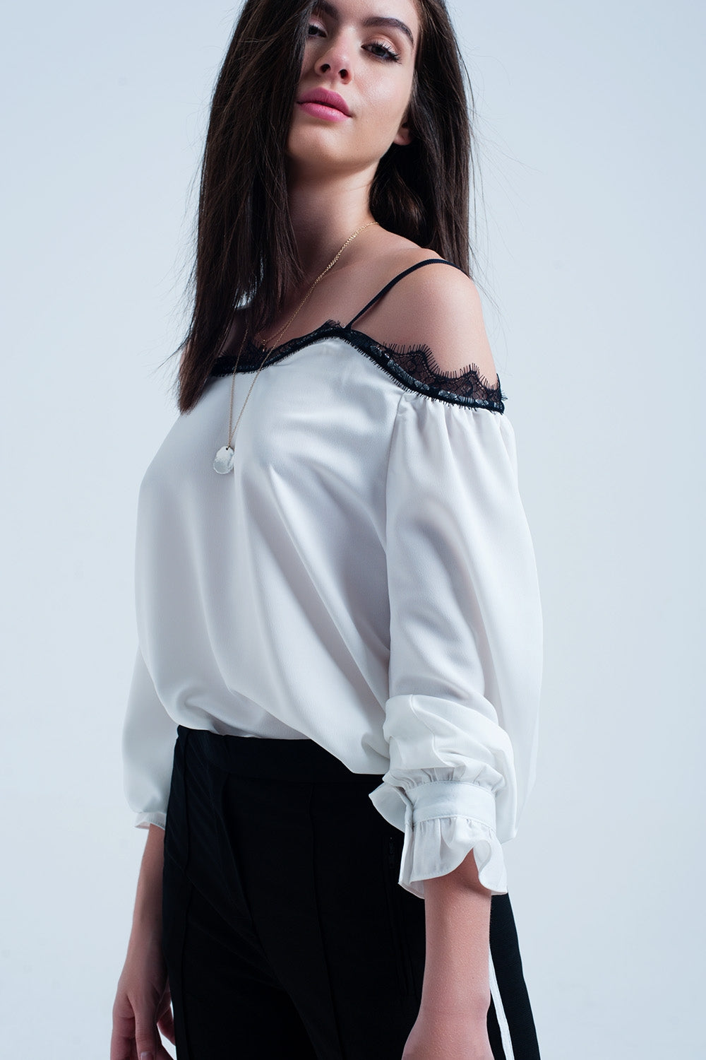 White top with black lace and bare shoulders