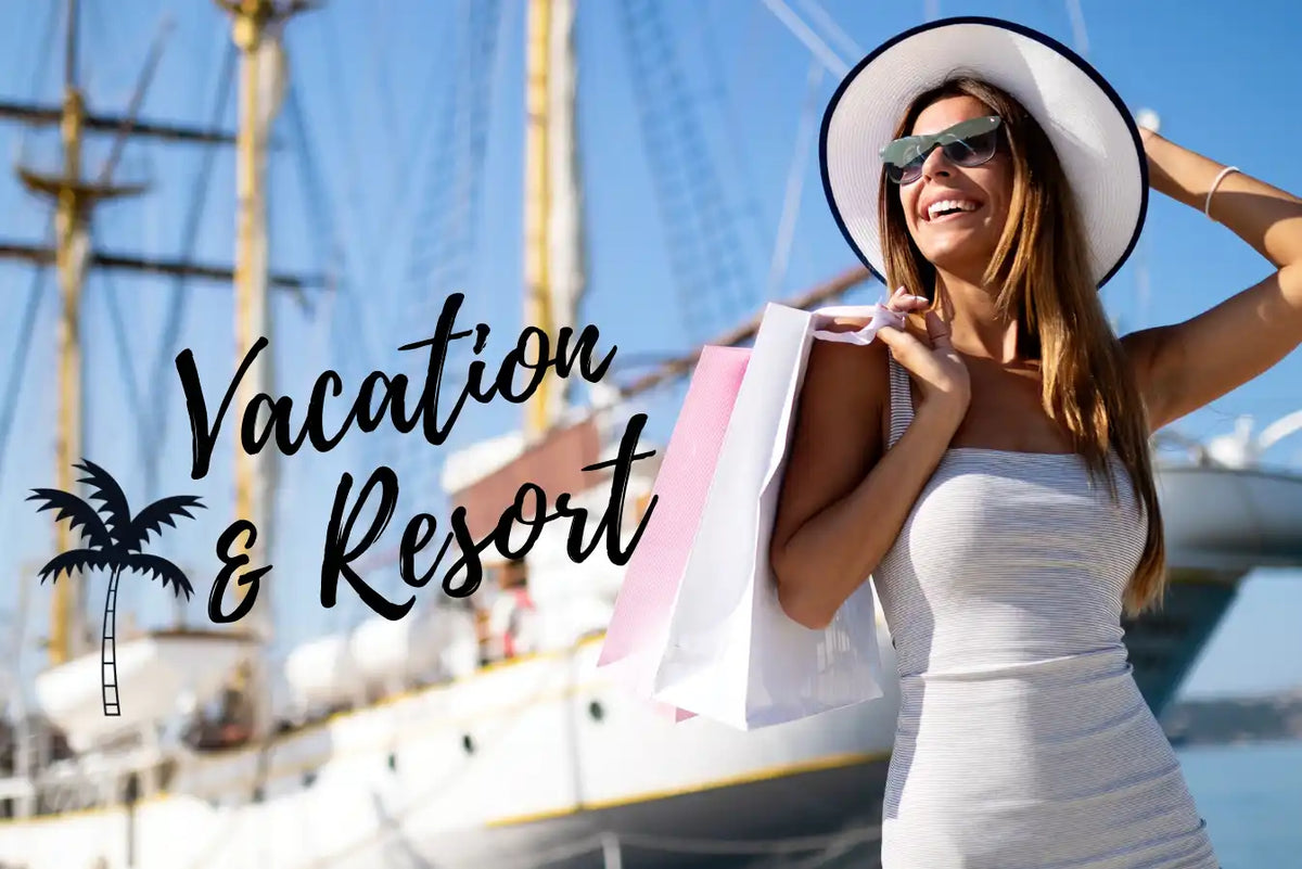 A smiling woman in a white dress, sun hat, and sunglasses holding shopping bags, with a large ship in the background.
