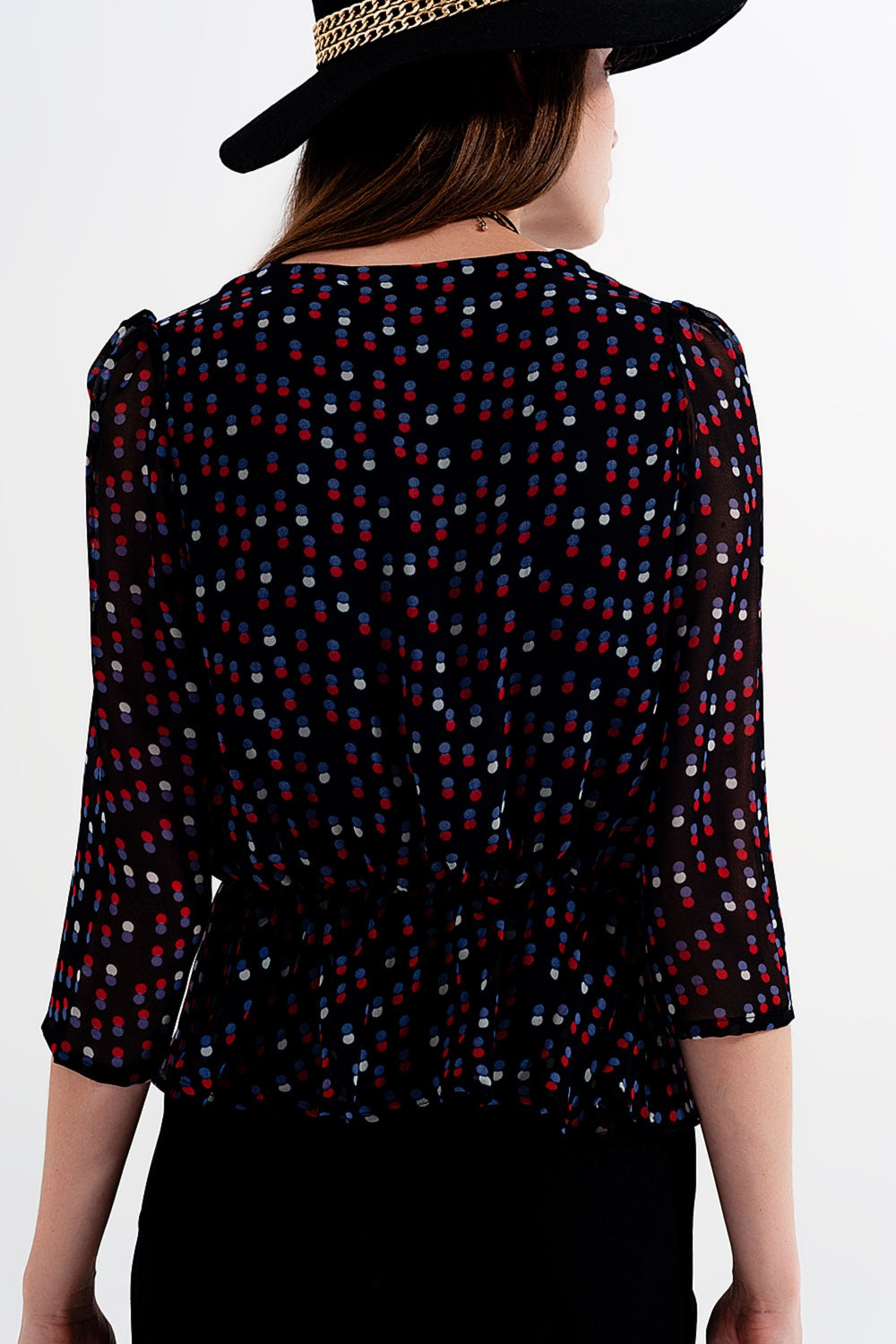 Wrap polka dot chiffon top in black